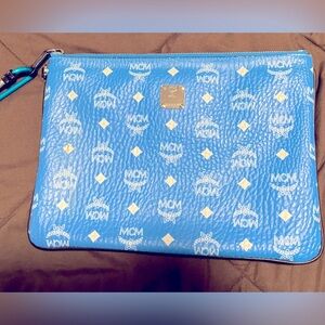Pre owed Blue MCM clutch.